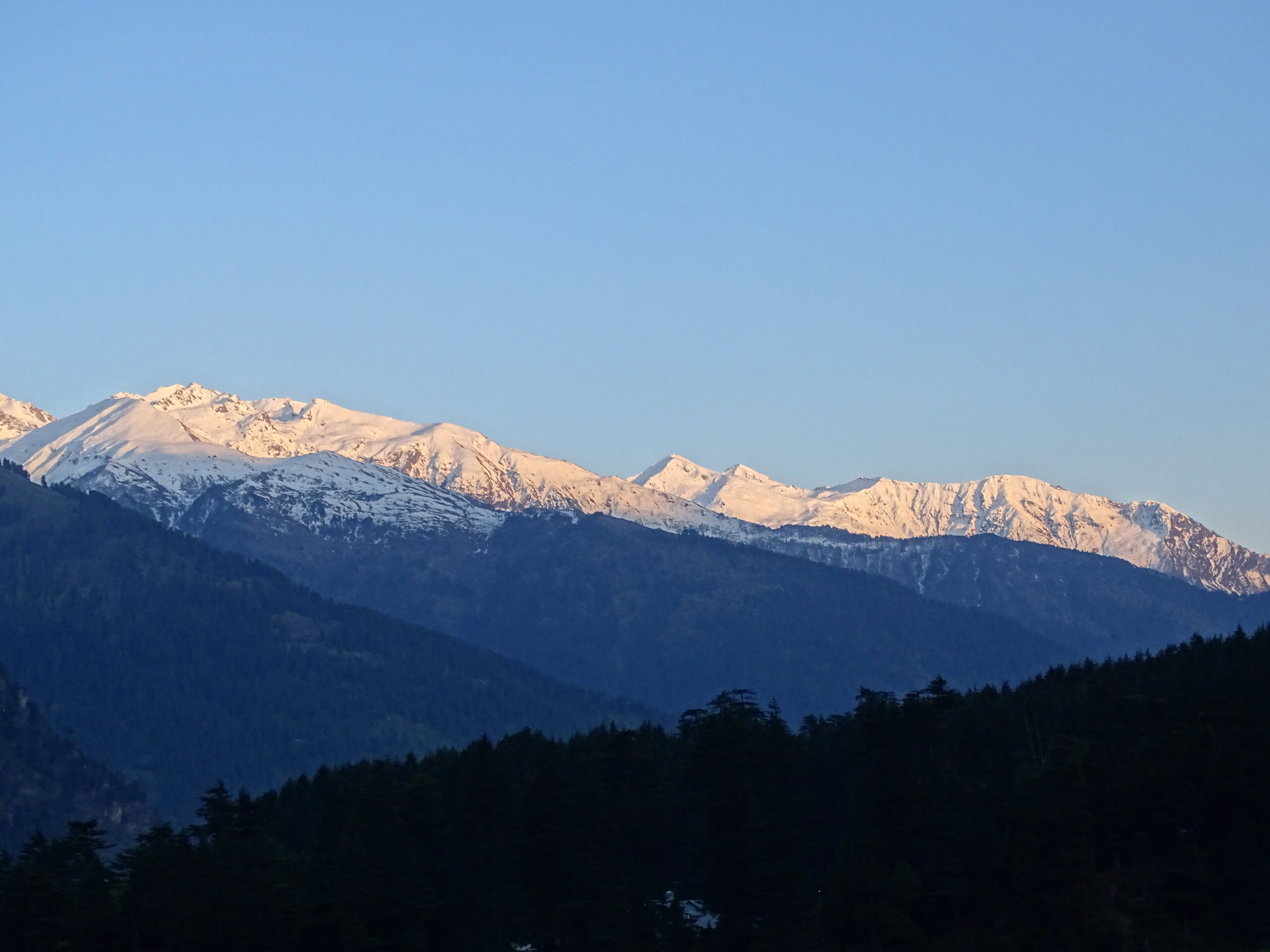Snow covered mountains at sunset in Manali, Himachal Pradesh